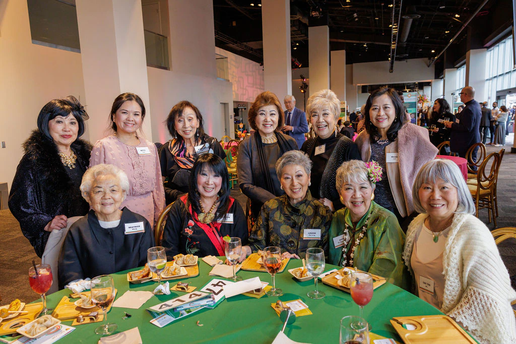 Staff at OnLok gather for a photo during a senior brunch